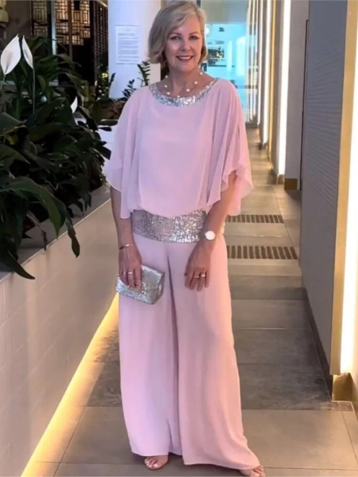 "Women's elegant chiffon set with sequin accents, featuring batwing-sleeve blouse and versatile wide-leg trousers."
