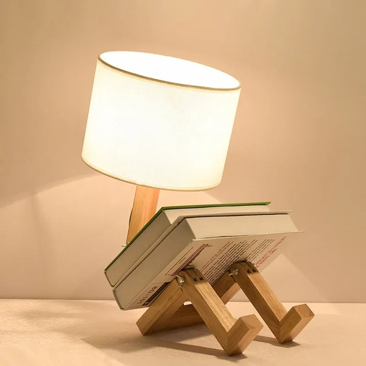 Innovative wooden robot desk lamp, a unique lighting solution with a built-in book stand. Modern aesthetic.