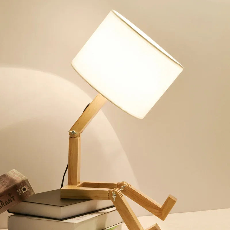 Practical wooden table lamp, robot-inspired, provides light and a sturdy book holder for your desk.