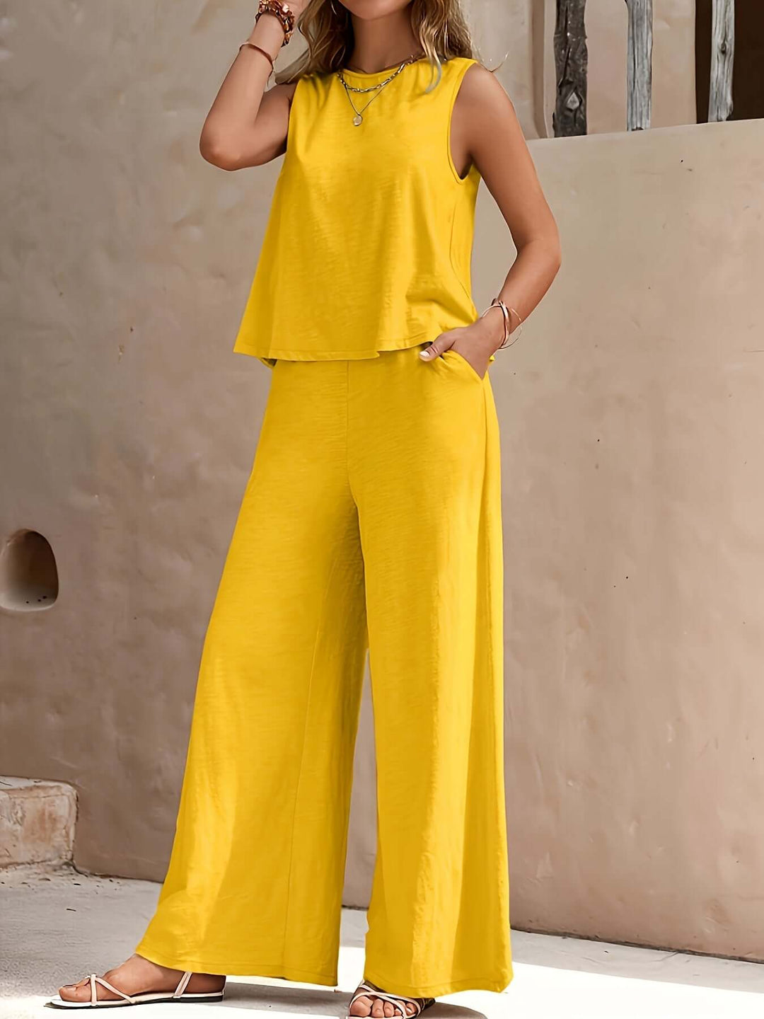 Yellow women's relaxed fit two-piece set with sleeveless top & wide-leg pants for comfortable summer casual wear.