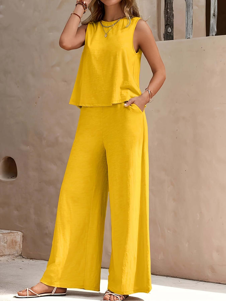 Yellow women's relaxed fit two-piece set with sleeveless top & wide-leg pants for comfortable summer casual wear.